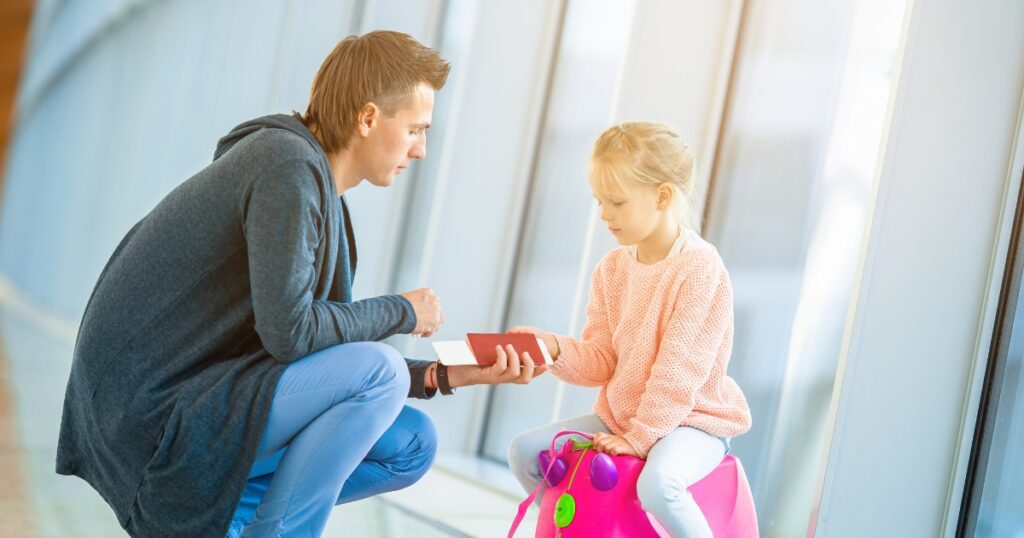toddler fathers day gifts. Picture of a dad with a daughter in an airport together.